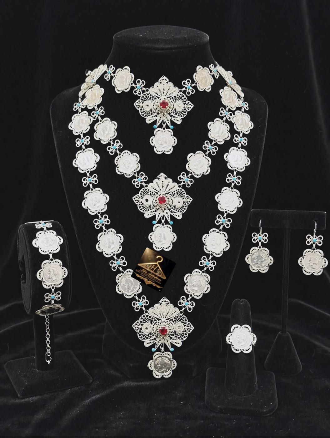 Pure silver One Layer Sika Mashati necklace set on black velvet — the full set: coin necklace, earrings, bracelet, and ring
